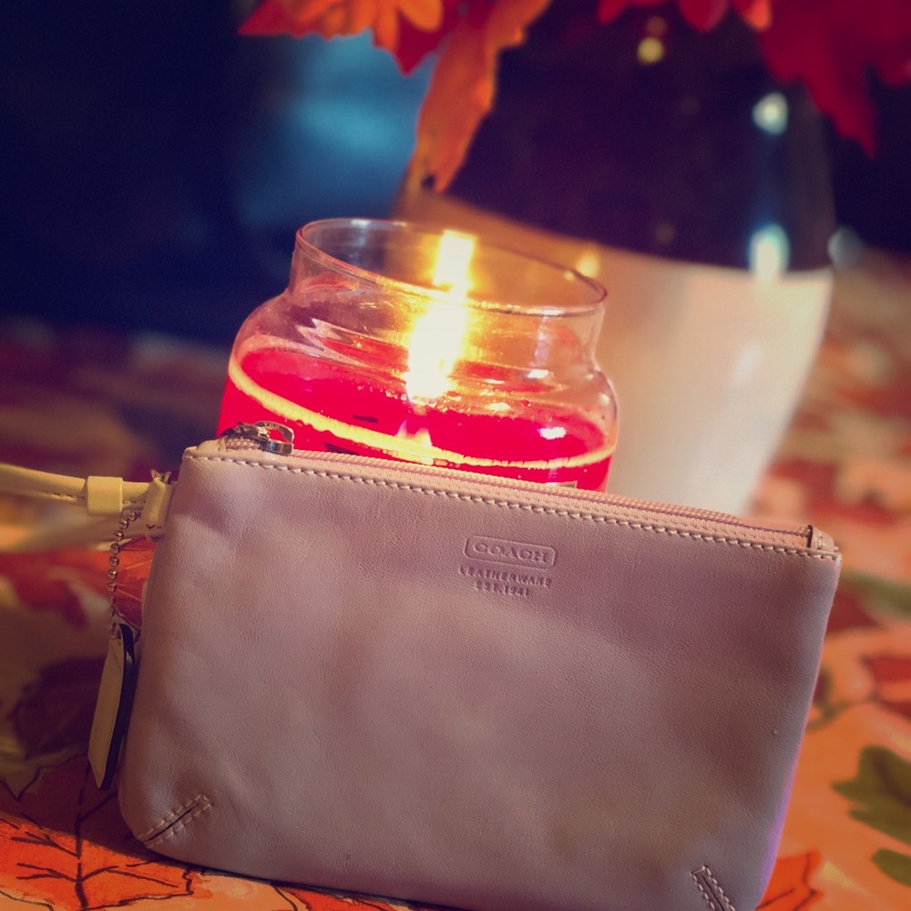 A coach bag and change purse as a set.